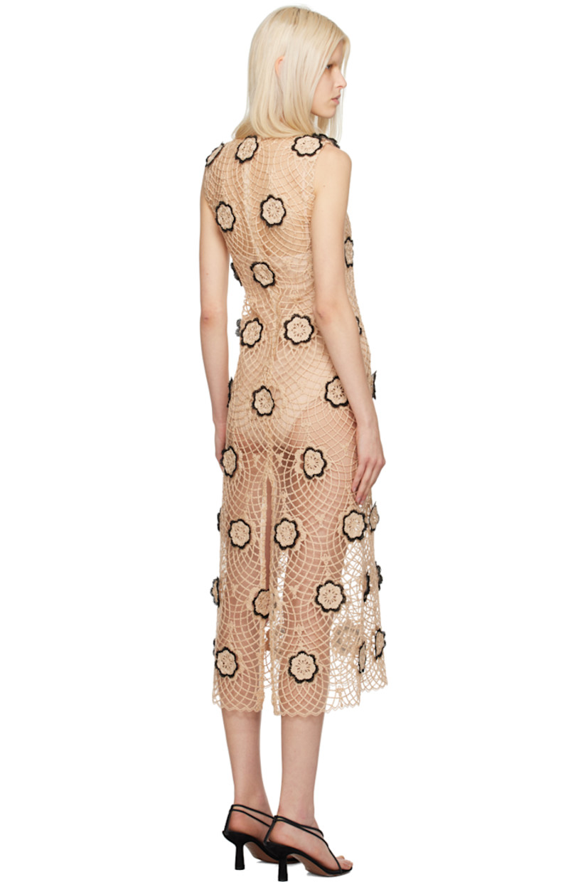 Sheer nylon-blend tulle and braided cotton jute dress. Floral appliqués throughout. 

· Round neck
· Zip closure at back
· Slit at back hem

Supplier color: Natural/Black