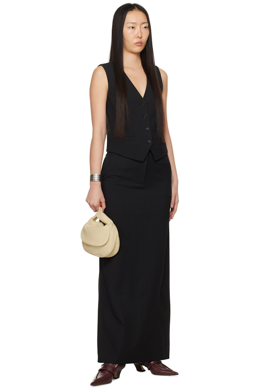 Plain-woven stretch polyester-blend skirt.

· High-rise
· Belt loops
· Two-pocket styling
· Zip-fly
· Darts at back waistband
· Central vent at back hem

Supplier color: Black