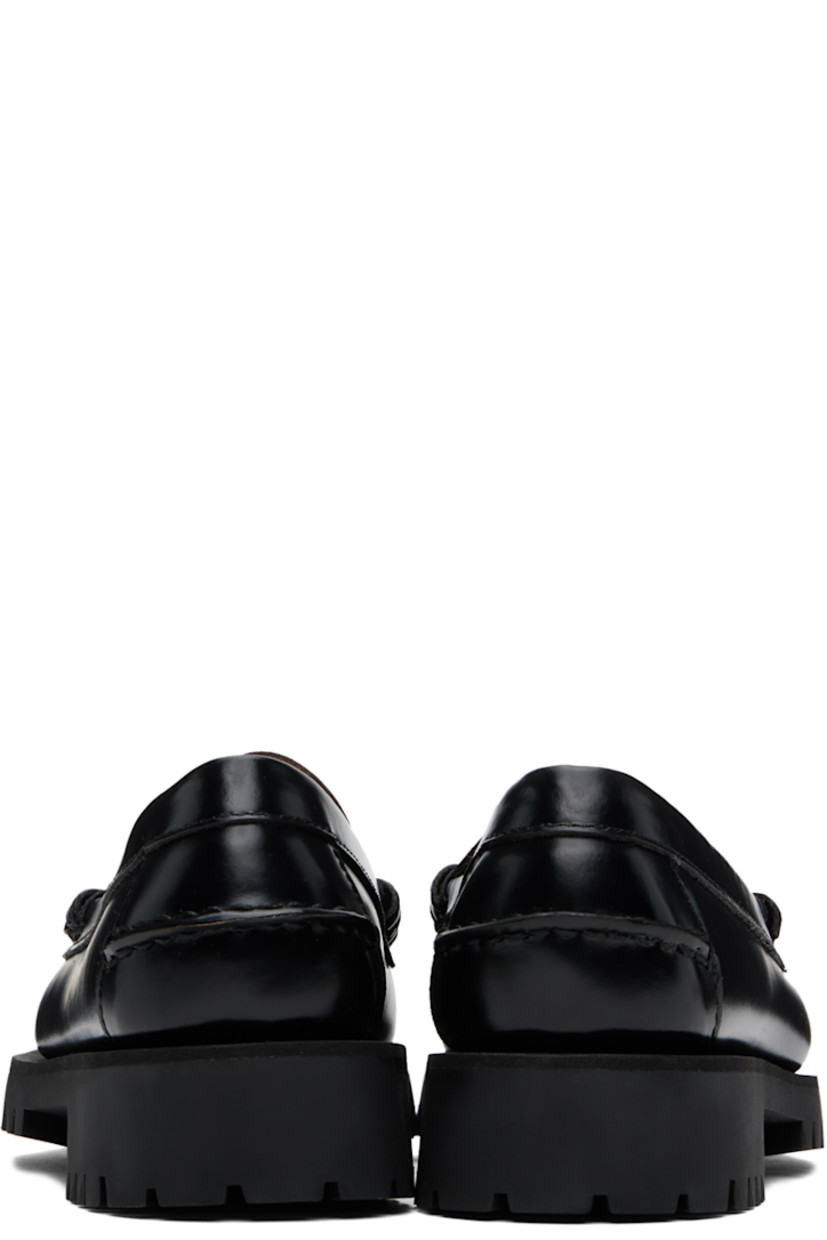 Handcrafted polished leather loafers in black.

· Moc toe
· Strap with cutout at vamp
· Suede lining
· Molded leather footbed
· Treaded rubber sole
· Heel: H1"

Part of the Citysides collection. 

Supplier color: Black