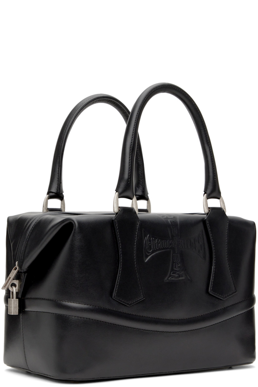 Grained calfskin duffle bag in black. 

· Twin rolled carry handles
· Logo embossed at face
· Bumper studs at base
· Logo-engraved padlock-style hardware at side
· Zip closure
· Zip and patch pockets at interior
· Removable structured compartment at interior
· Full suede lining
· H8" x W12" x 7.5"

Supplier color: Black
