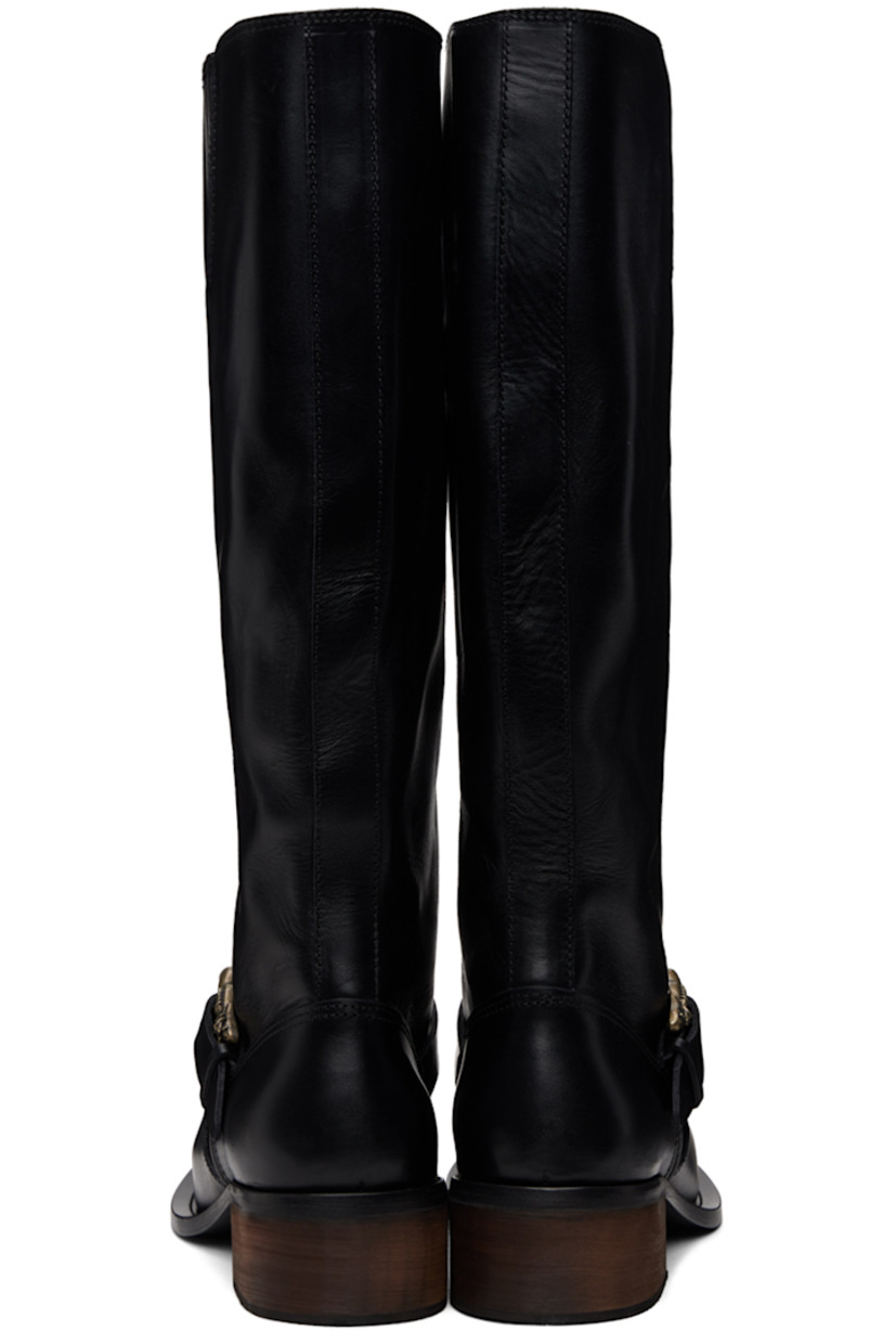 Calf-high grained horse leather boots in black.

· Pin-buckle strap at vamp
· Wood block heel with rubber injection 
· Leather sole
· Heel: H1.75"

Supplier color: Black