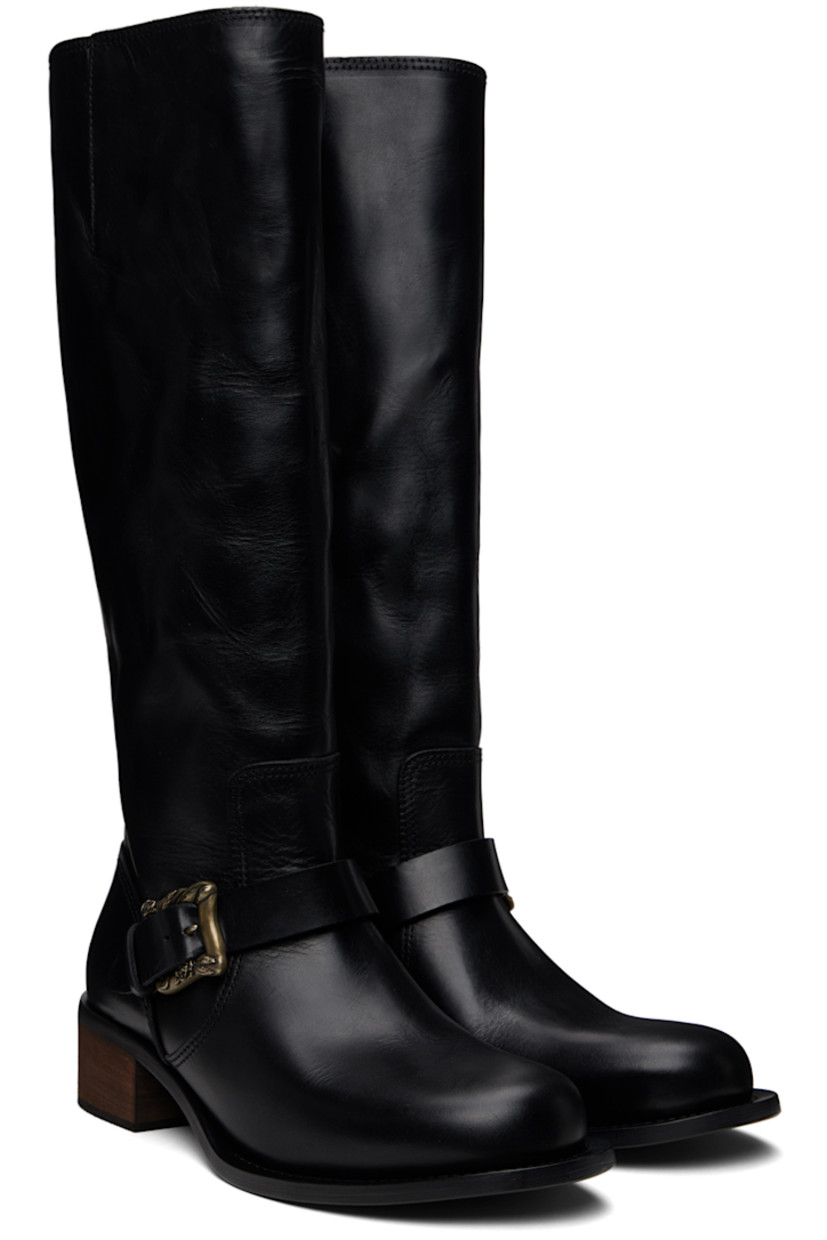 Calf-high grained horse leather boots in black.

· Pin-buckle strap at vamp
· Wood block heel with rubber injection 
· Leather sole
· Heel: H1.75"

Supplier color: Black