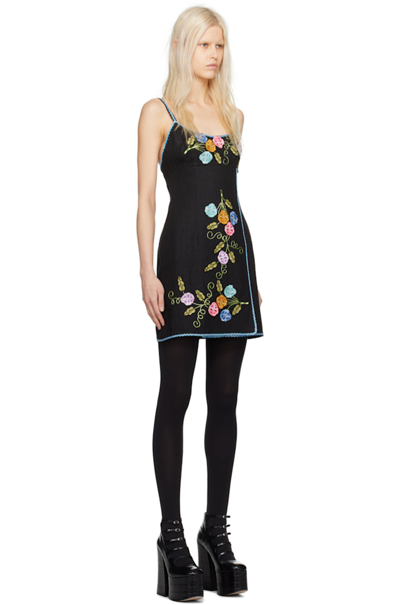 Linen hopsack dress. Floral pattern embroidered, metallic thread detailing, and scalloped trim throughout.

· Wrap construction
· Scoop neck
· Slit at front hem
· Zip closure at back
· Full sateen lining

Supplier color: Black multi