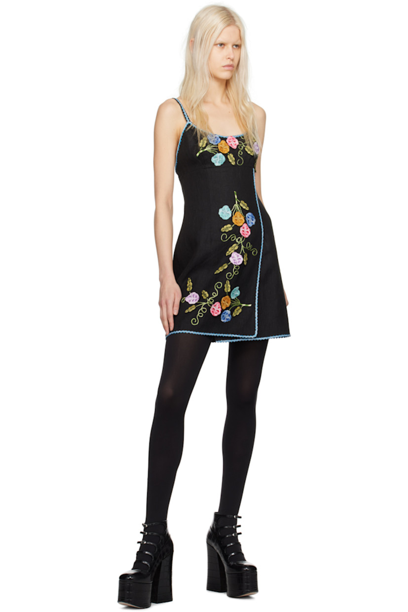 Linen hopsack dress. Floral pattern embroidered, metallic thread detailing, and scalloped trim throughout.

· Wrap construction
· Scoop neck
· Slit at front hem
· Zip closure at back
· Full sateen lining

Supplier color: Black multi