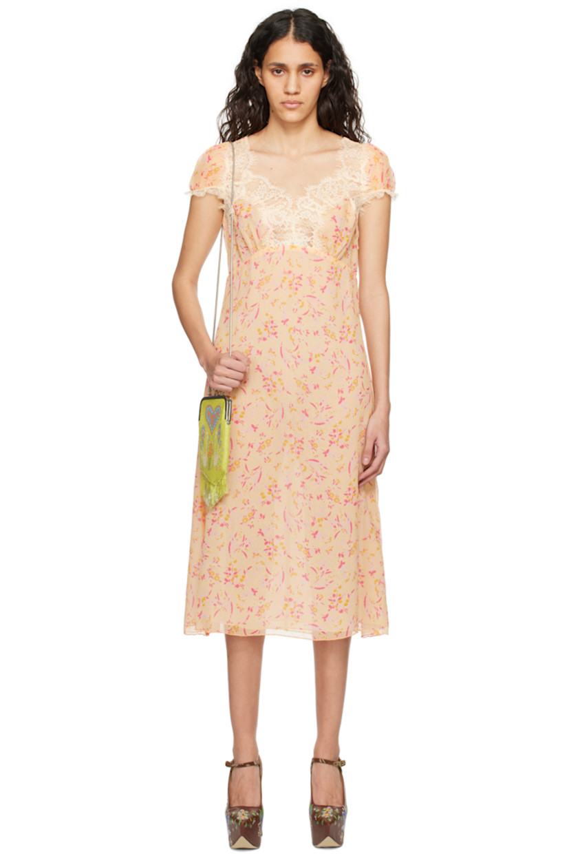 Silk crepon dress. Floral pattern printed throughout.

· Scalloped lace trim at sweetheart neck and cuffs
· Elasticized cuffs
· Concealed zip closure at back
· Full chiffon lining

Supplier color: Cantaloupe multi