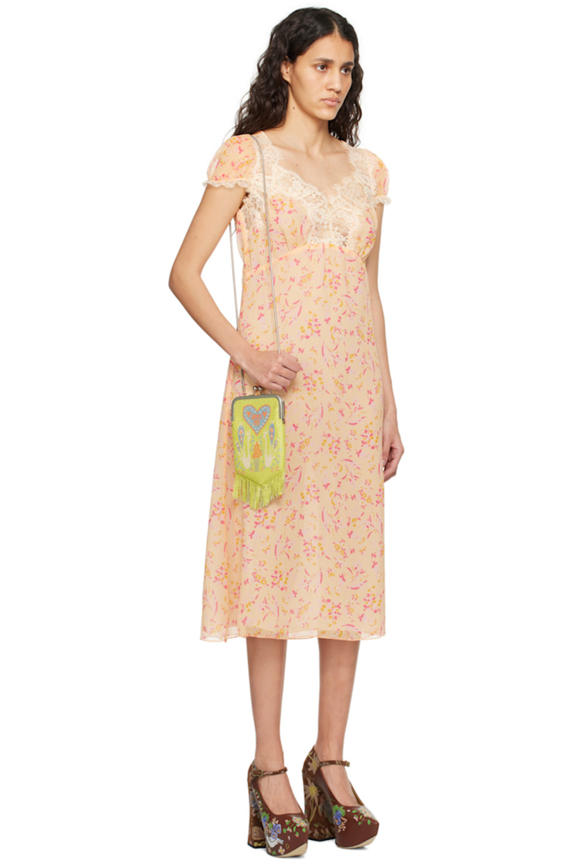 Silk crepon dress. Floral pattern printed throughout.

· Scalloped lace trim at sweetheart neck and cuffs
· Elasticized cuffs
· Concealed zip closure at back
· Full chiffon lining

Supplier color: Cantaloupe multi