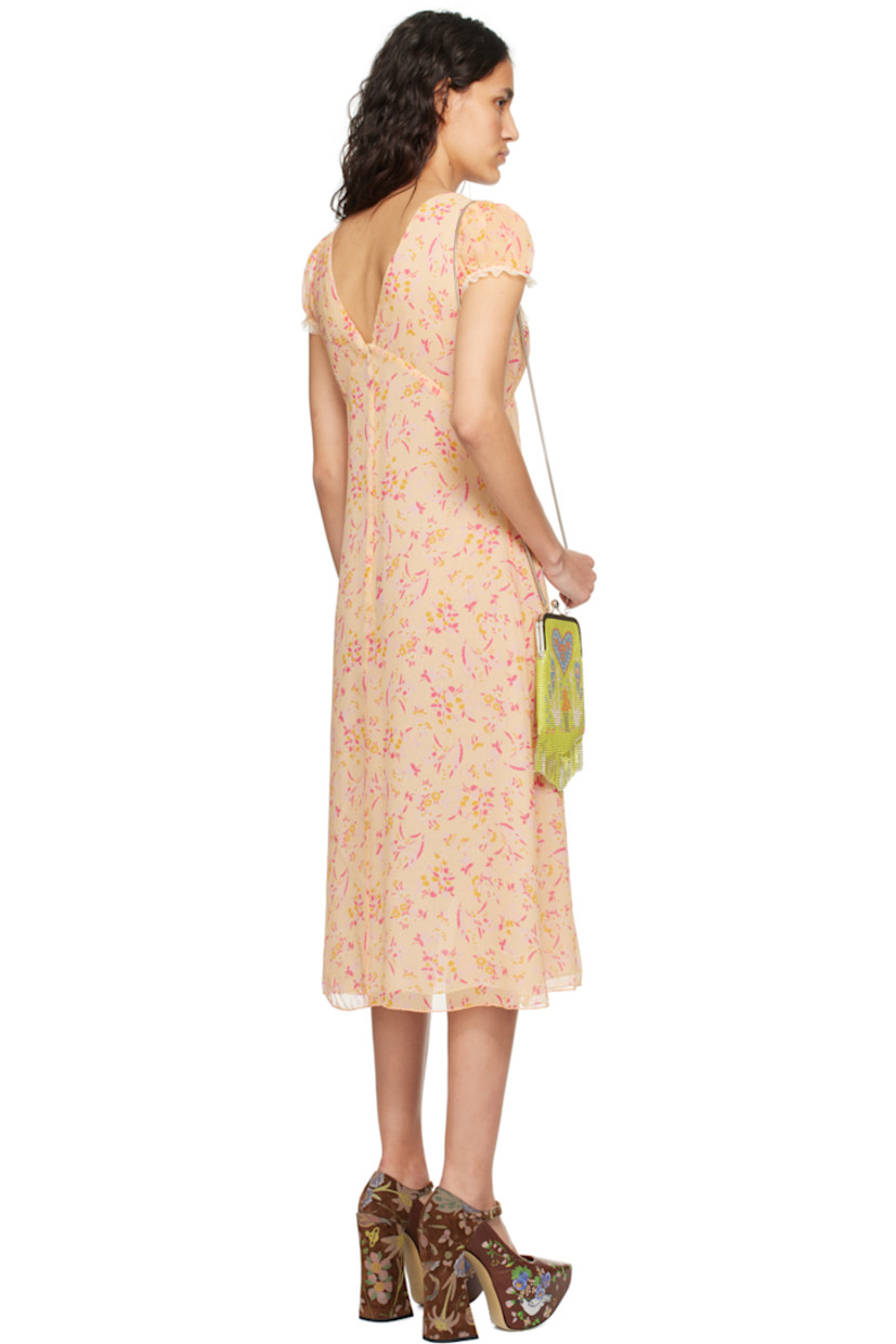 Silk crepon dress. Floral pattern printed throughout.

· Scalloped lace trim at sweetheart neck and cuffs
· Elasticized cuffs
· Concealed zip closure at back
· Full chiffon lining

Supplier color: Cantaloupe multi