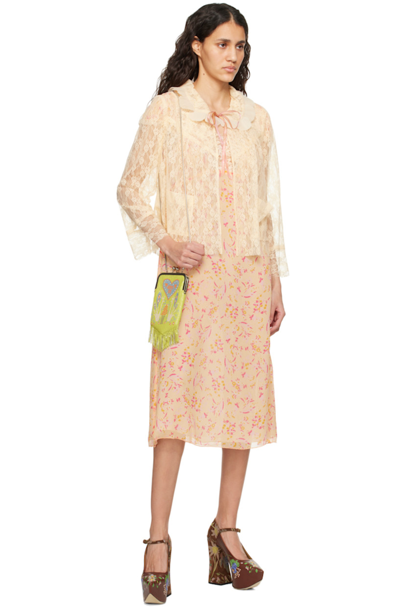Silk crepon dress. Floral pattern printed throughout.

· Scalloped lace trim at sweetheart neck and cuffs
· Elasticized cuffs
· Concealed zip closure at back
· Full chiffon lining

Supplier color: Cantaloupe multi