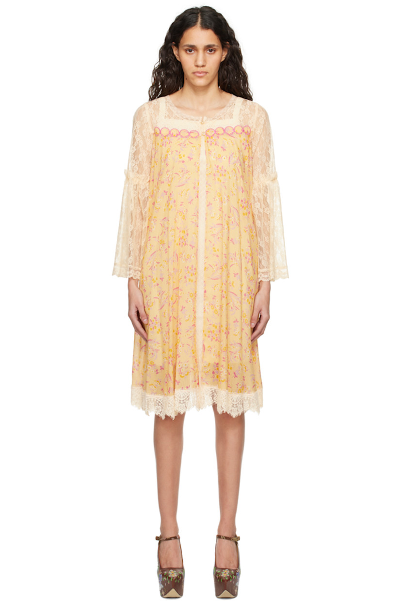Semi-sheer cotton-blend gauze and nylon lace dress. Floral pattern and scalloped edges throughout.

· Scoop neck
· Button closure
· Graphic appliqués at chest
· Gathering at flared sleeves

Supplier color: Cantaloupe multi