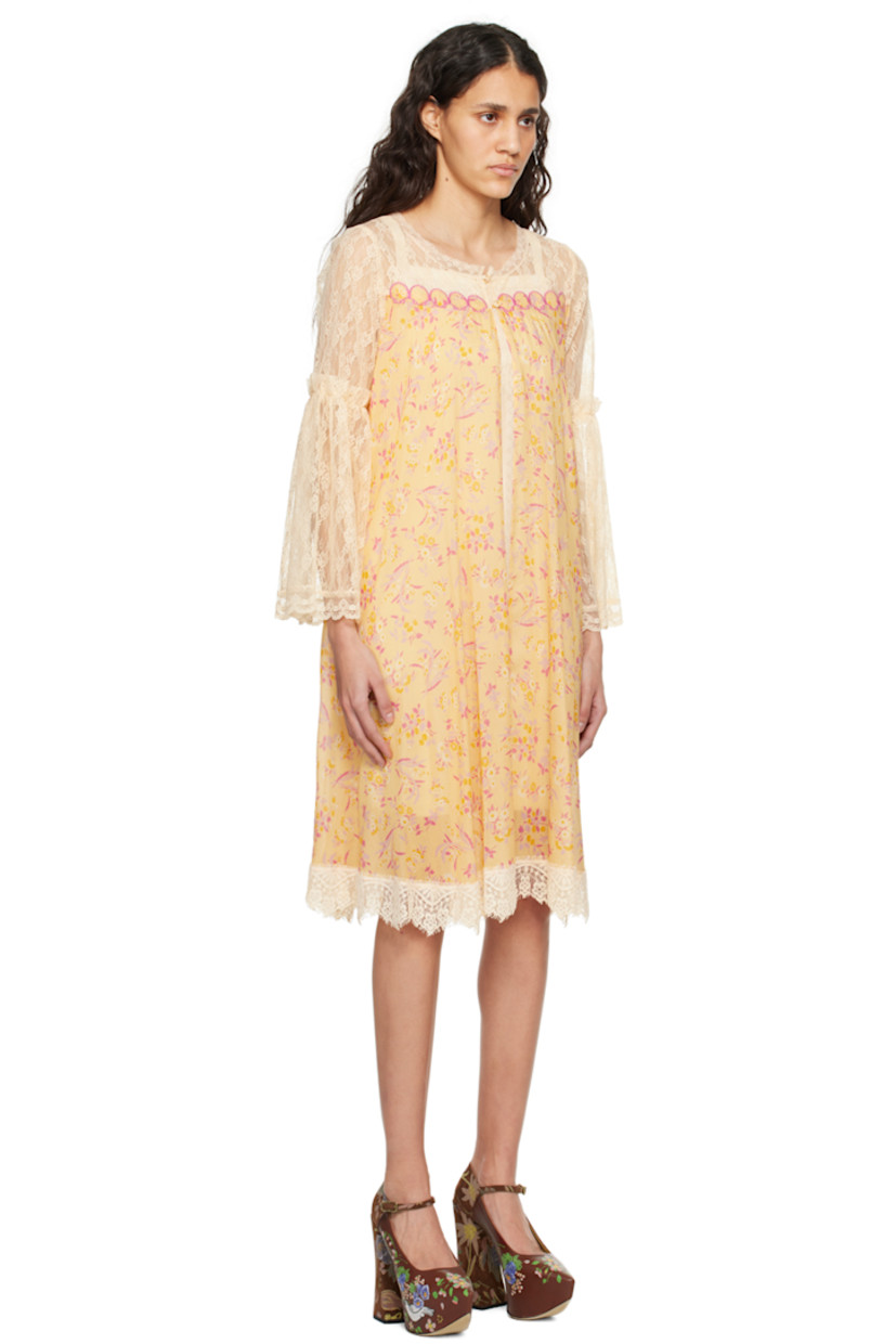 Semi-sheer cotton-blend gauze and nylon lace dress. Floral pattern and scalloped edges throughout.

· Scoop neck
· Button closure
· Graphic appliqués at chest
· Gathering at flared sleeves

Supplier color: Cantaloupe multi