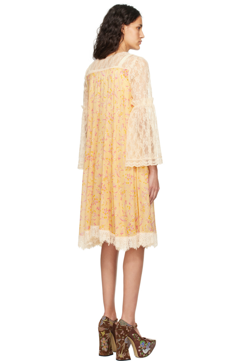 Semi-sheer cotton-blend gauze and nylon lace dress. Floral pattern and scalloped edges throughout.

· Scoop neck
· Button closure
· Graphic appliqués at chest
· Gathering at flared sleeves

Supplier color: Cantaloupe multi
