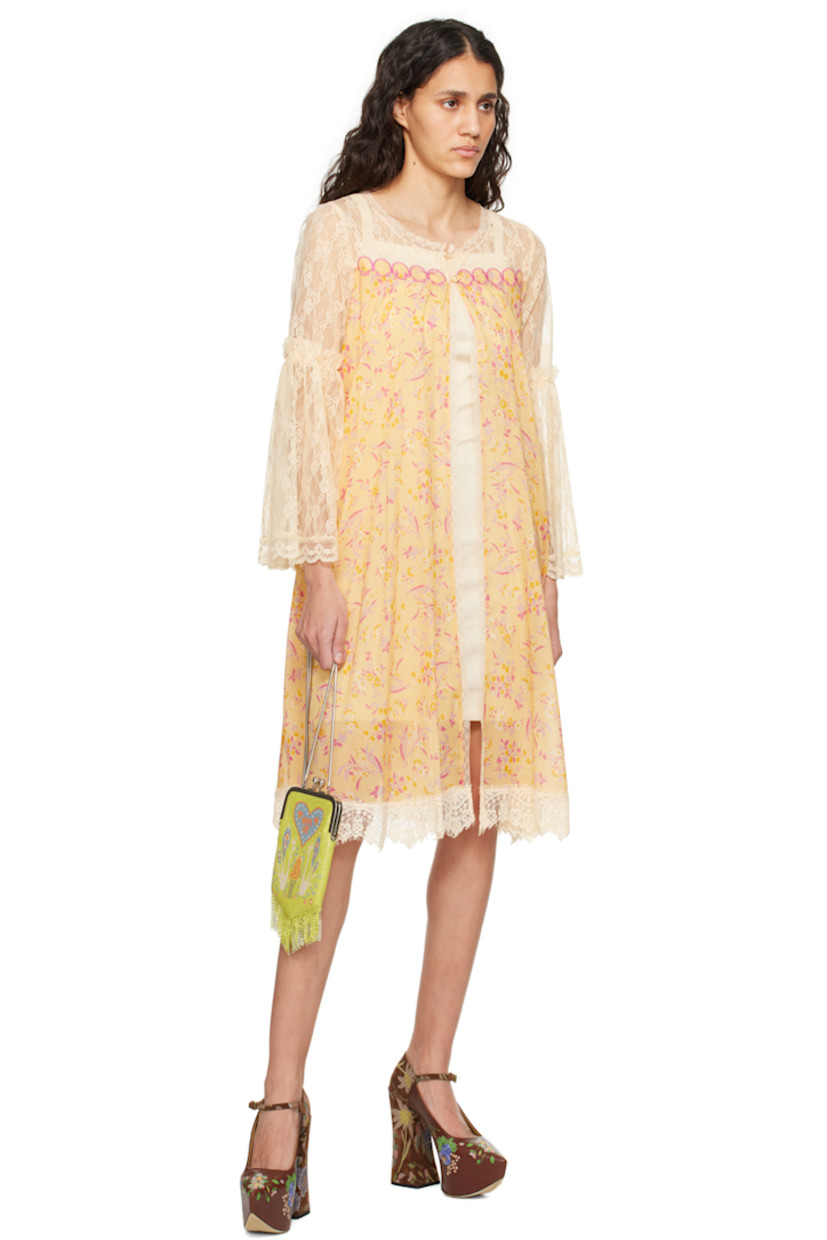 Semi-sheer cotton-blend gauze and nylon lace dress. Floral pattern and scalloped edges throughout.

· Scoop neck
· Button closure
· Graphic appliqués at chest
· Gathering at flared sleeves

Supplier color: Cantaloupe multi