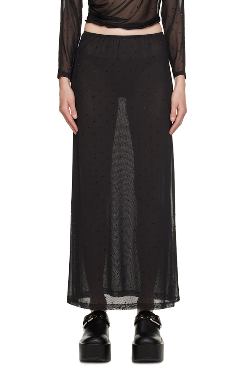 Semi-sheer stretch polyester mesh skirt. Crystal-cut appliqués throughout.

· Elasticized waistband
· Slit at side seam
· Fully lined

Supplier color: Black