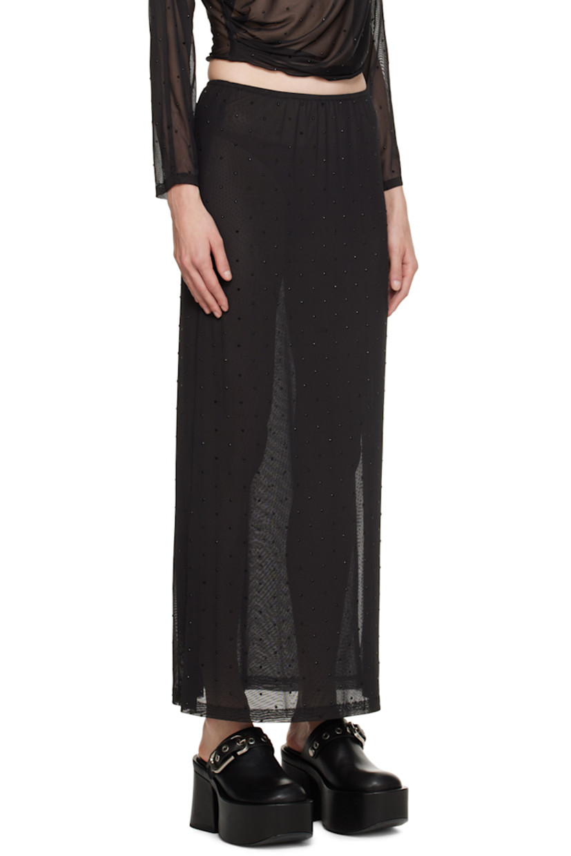 Semi-sheer stretch polyester mesh skirt. Crystal-cut appliqués throughout.

· Elasticized waistband
· Slit at side seam
· Fully lined

Supplier color: Black