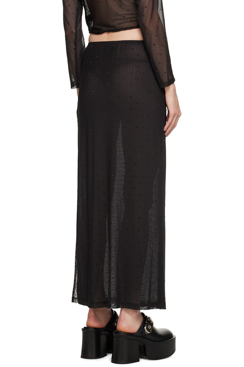 Semi-sheer stretch polyester mesh skirt. Crystal-cut appliqués throughout.

· Elasticized waistband
· Slit at side seam
· Fully lined

Supplier color: Black