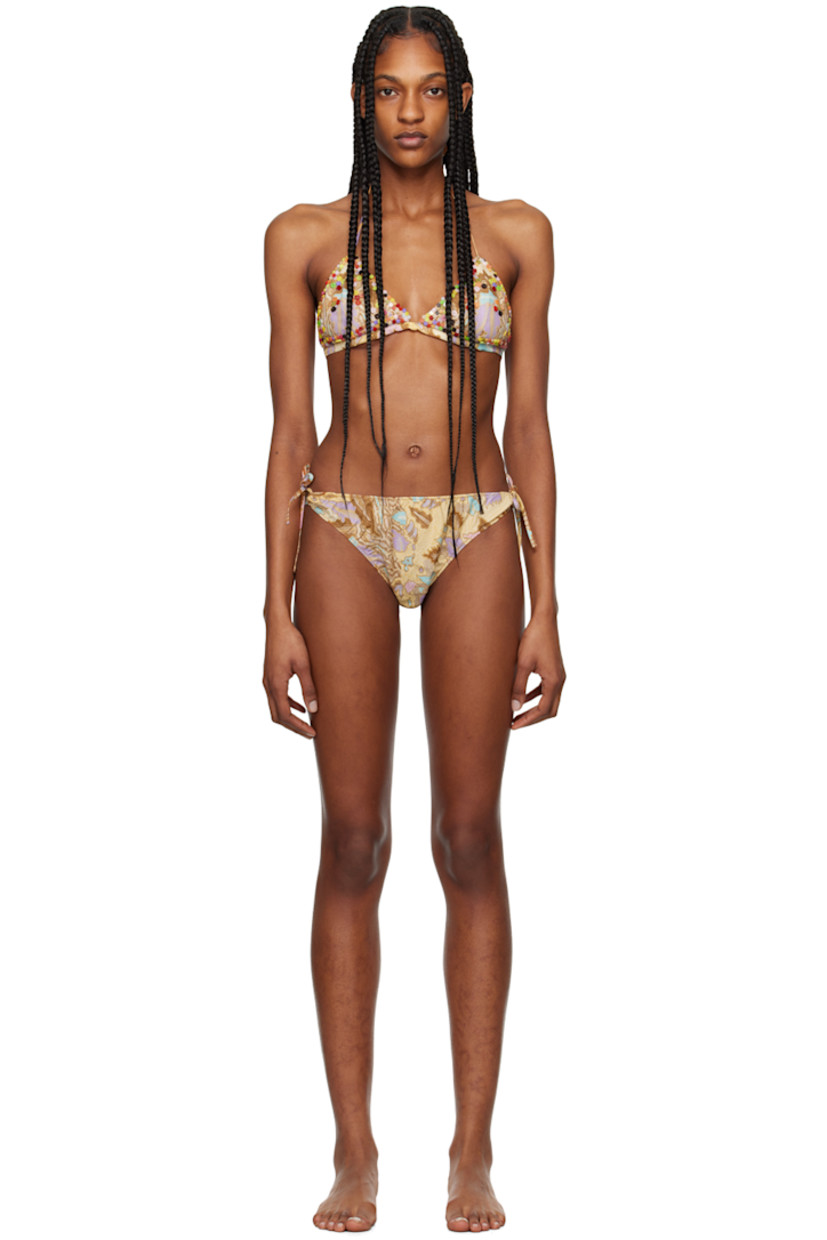 Cotton jersey bikini top. Beaded detailing and graphic pattern printed throughout.

· Plunging V-neck
· Self-tie halter strap and straps at back
· Full stretch mesh lining

Cotton jersey bikini bottom. Graphic pattern printed throughout.

· Elasticized waistband and cuffs
· Self-tie fastening at side seams
· Partial stretch mesh lining

Supplier color: Cantaloupe multi