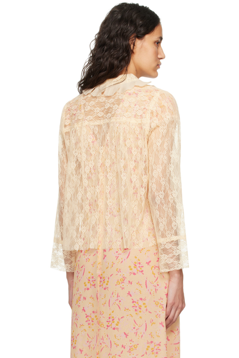 Sheer nylon lace blouse. Gathering and jacquard floral pattern throughout.

· Pleated ruffles at Peter Pan collar
· Self-tie closure
· Patch pockets
· Raw edge at hem and cuffs

Supplier color: Cantaloupe multi