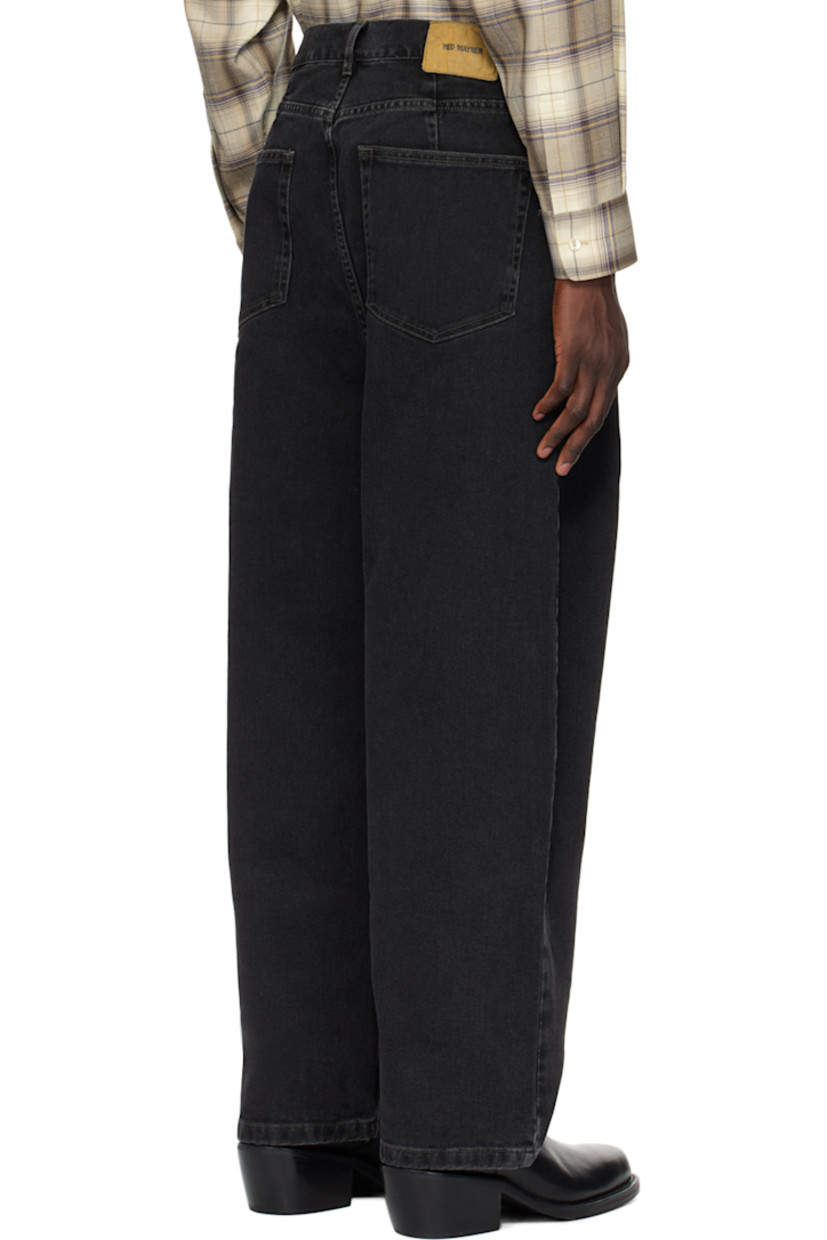 Heavyweight non-stretch denim jeans. Fading throughout.

· Belt loops
· Five-pocket styling
· Zip-fly
· Pleats at front
· Jacron logo patch at back waistband

Supplier color: Black