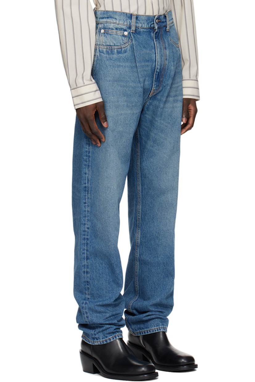 Heavyweight non-stretch denim jeans. Fading and whiskering throughout.

· Belt loops
· Five-pocket styling
· Zip-fly
· Pleats at front
· Jacron logo patch at back waistband
· Contrast stitching in orange

Supplier color: Open blue