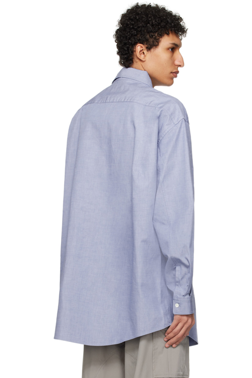 Cotton oxford cloth shirt.

· Spread collar
· Button closure
· Shirttail hem
· Single-button barrel cuffs
· Twin pleats at back yoke

Supplier color: Dark blue
