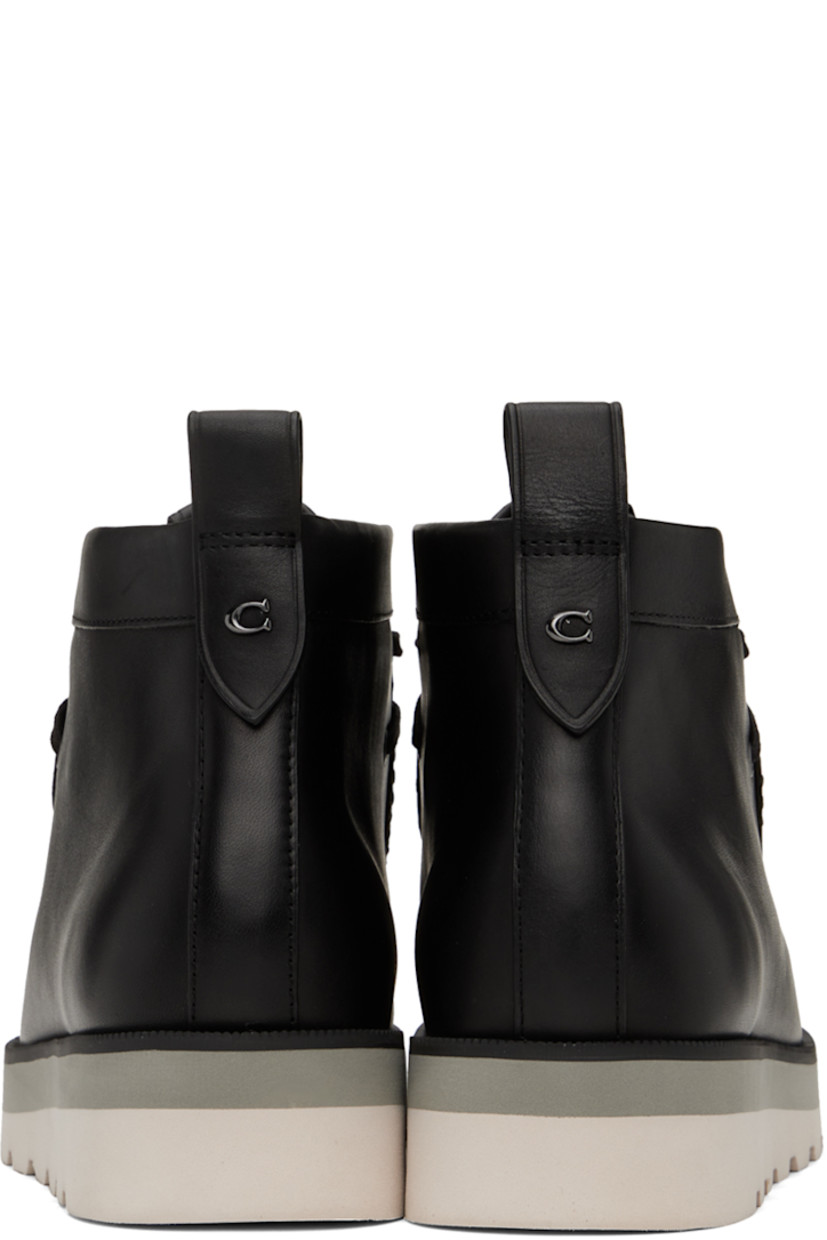 Ankle-high paneled coated canvas and buffed leather boots in black.

· Moc toe
· Lace-up closure
· Jacquard logo pattern at vamp
· Leather logo patch at bellows tongue
· Pull-loop at back collar
· Logo hardware at heel tab
· Logo-embossed at padded footbed
· Faux-leather lining
· EVA foam midsole
· Treaded foam rubber sole
· Silver-tone hardware

Supplier color: Black