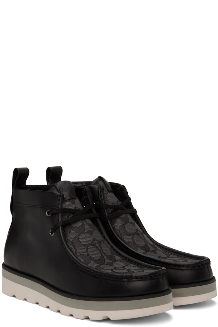 Ankle-high paneled coated canvas and buffed leather boots in black.

· Moc toe
· Lace-up closure
· Jacquard logo pattern at vamp
· Leather logo patch at bellows tongue
· Pull-loop at back collar
· Logo hardware at heel tab
· Logo-embossed at padded footbed
· Faux-leather lining
· EVA foam midsole
· Treaded foam rubber sole
· Silver-tone hardware

Supplier color: Black
