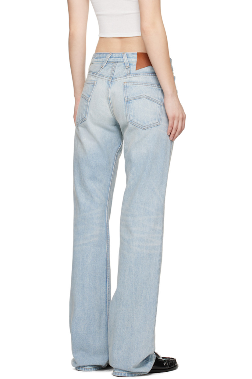Non-stretch denim jeans. Fading and whiskering throughout. 

· Belt loops
· Five-pocket styling
· Zip-fly 
· Leather logo patch at back waist 
· Logo-engraved silver-tone hardware
· Contrast stitching in tan

Available exclusively at SSENSE.

Supplier color: Light indigo