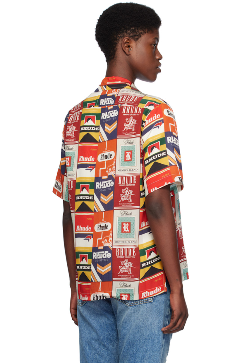 Silk satin shirt. Logo graphic printed throughout. 

· Open spread collar 
· Button closure 
· Patch pocket 
· Tennis-tail hem 

Supplier color: Red multi