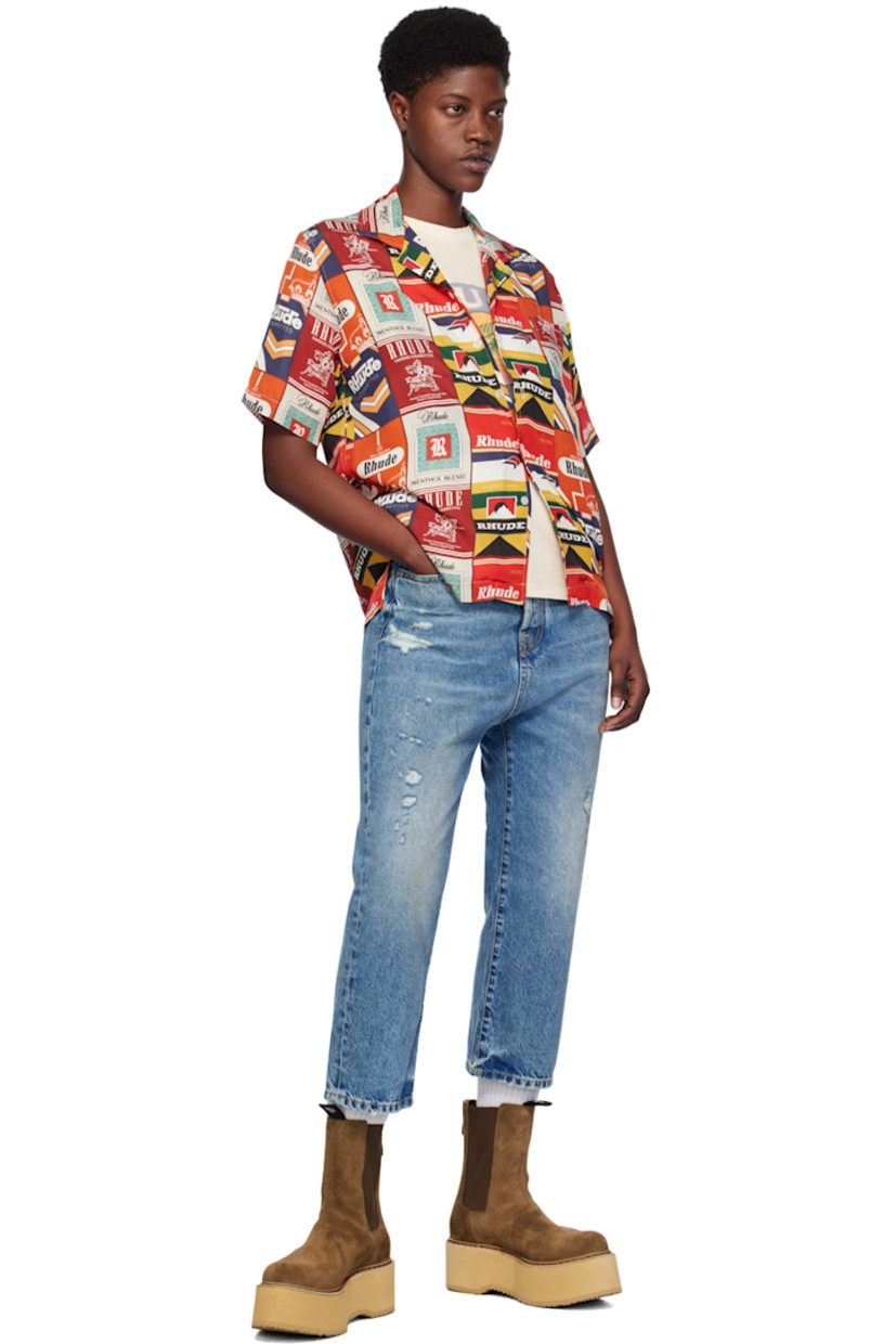Silk satin shirt. Logo graphic printed throughout. 

· Open spread collar 
· Button closure 
· Patch pocket 
· Tennis-tail hem 

Supplier color: Red multi