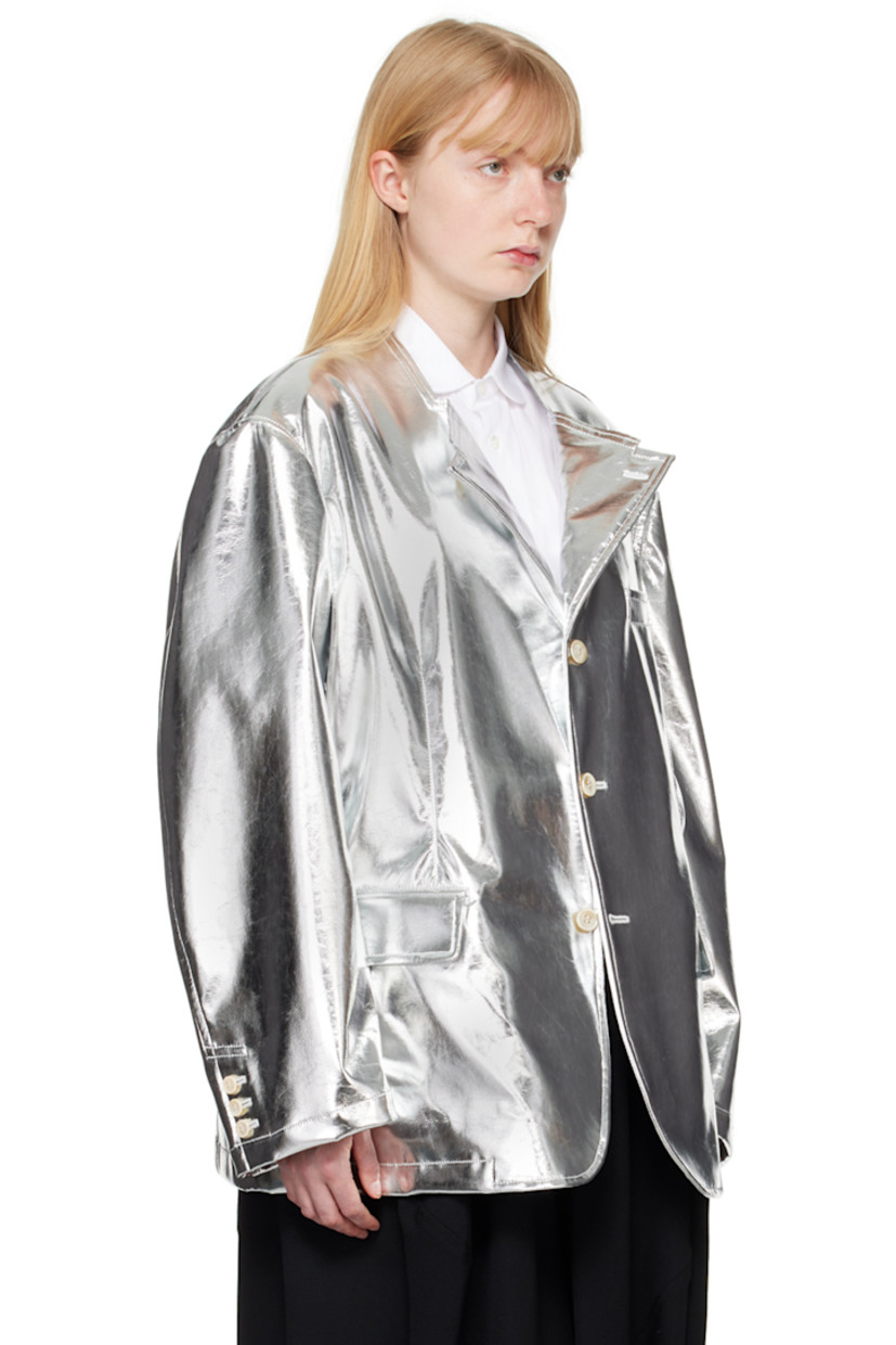 Grained faux-leather blazer.

· Modified notched lapel
· Button closure
· Welt pocket at chest
· Flap pockets
· Three-button barrel cuffs
· Central vent at back hem
· Full taffeta lining

Supplier color: Silver