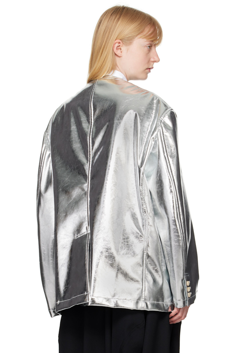 Grained faux-leather blazer.

· Modified notched lapel
· Button closure
· Welt pocket at chest
· Flap pockets
· Three-button barrel cuffs
· Central vent at back hem
· Full taffeta lining

Supplier color: Silver