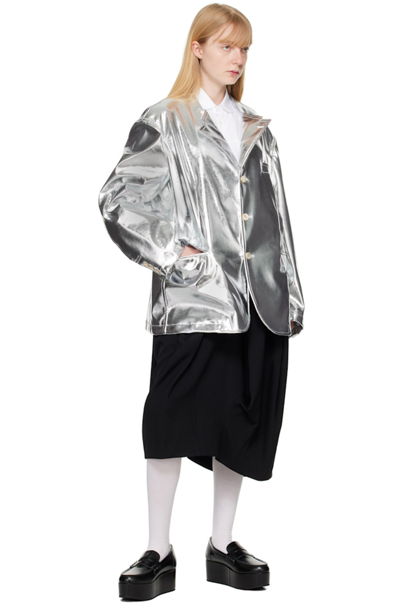 Grained faux-leather blazer.

· Modified notched lapel
· Button closure
· Welt pocket at chest
· Flap pockets
· Three-button barrel cuffs
· Central vent at back hem
· Full taffeta lining

Supplier color: Silver