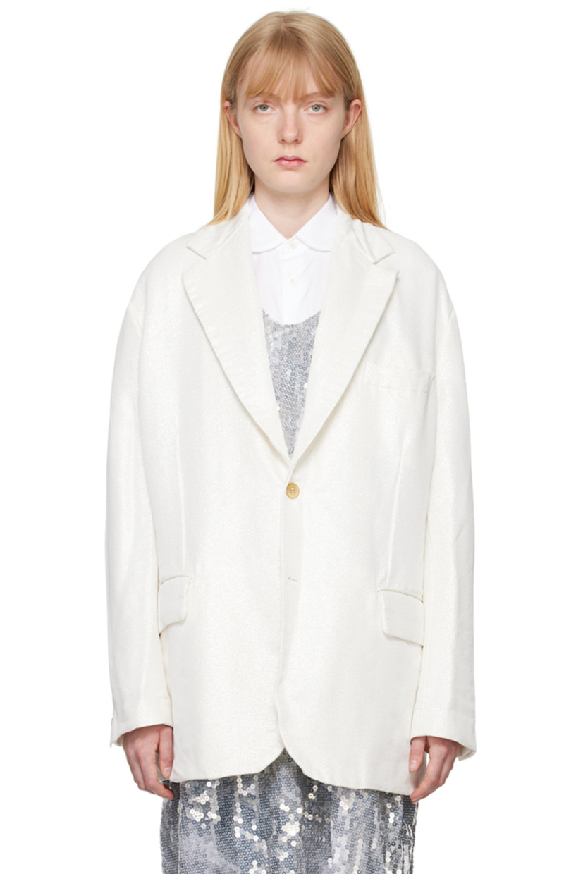 Garment-treated polyester lamé blazer. Herringbone pattern and metallic thread detailing throughout.

· Notched lapel
· Button closure
· Welt pocket at chest
· Flap pockets
· Three-button surgeon's cuffs
· Cutout and raw edges at back armscyes
· Central vent at back hem
· Partial plain-woven lining

Supplier color: White
