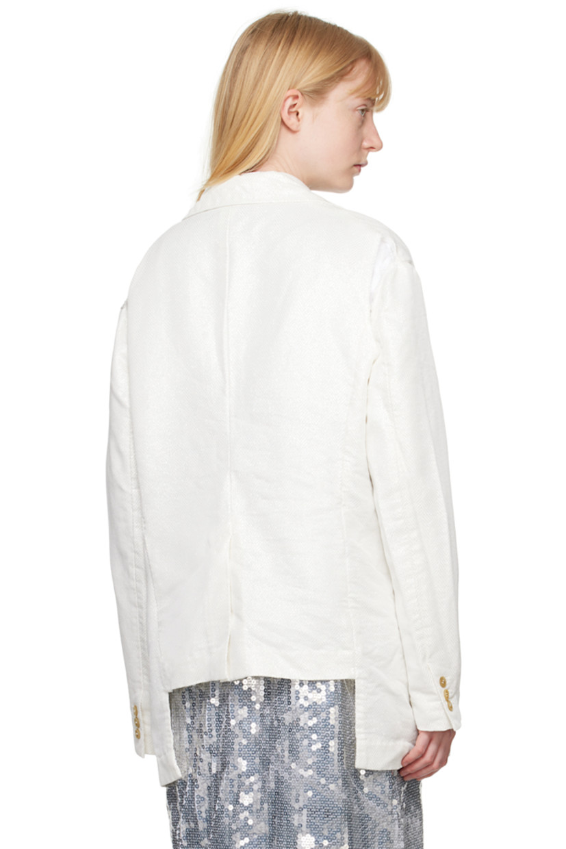 Garment-treated polyester lamé blazer. Herringbone pattern and metallic thread detailing throughout.

· Notched lapel
· Button closure
· Welt pocket at chest
· Flap pockets
· Three-button surgeon's cuffs
· Cutout and raw edges at back armscyes
· Central vent at back hem
· Partial plain-woven lining

Supplier color: White