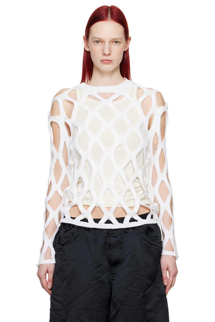 Knit acrylic sweater.

· Cutouts throughout
· Rib knit crewneck, hem, and cuffs

Supplier color: White