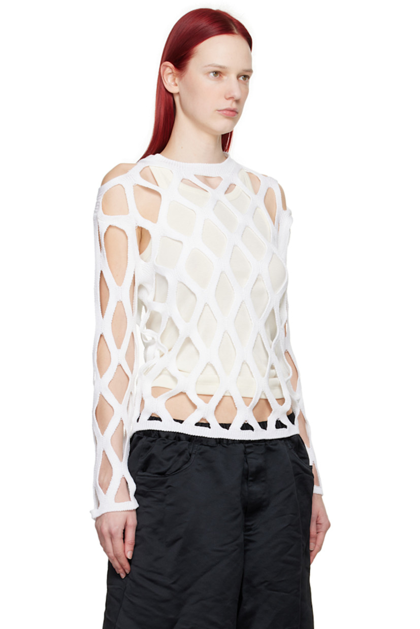 Knit acrylic sweater.

· Cutouts throughout
· Rib knit crewneck, hem, and cuffs

Supplier color: White