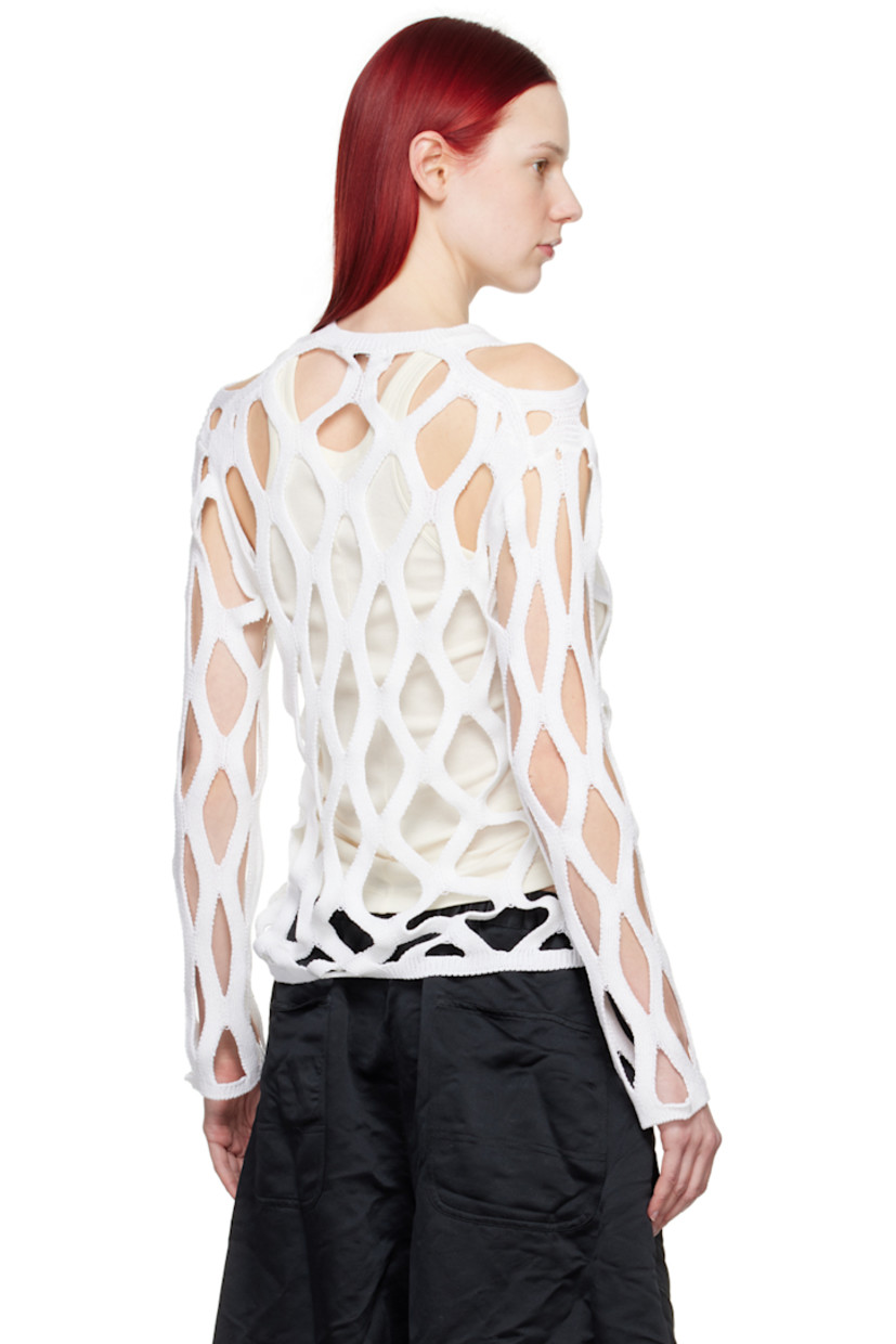 Knit acrylic sweater.

· Cutouts throughout
· Rib knit crewneck, hem, and cuffs

Supplier color: White
