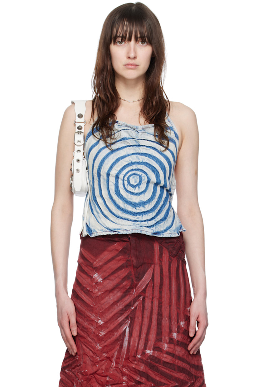 Non-stretch denim tank top. Fading and creases throughout. 

· Self-tie halter strap at sweetheart neck
· Self-tie closure at low back
· Unlined

Supplier color: Indigo