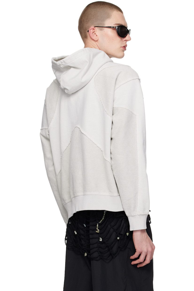 Heavyweight reverse French terry and French terry hoodie. Exposed seams and raw edges throughout.

· Paneled construction
· Logo embroidered at chest
· Rib knit hem and cuffs
· Dropped shoulders

Supplier color: Stone