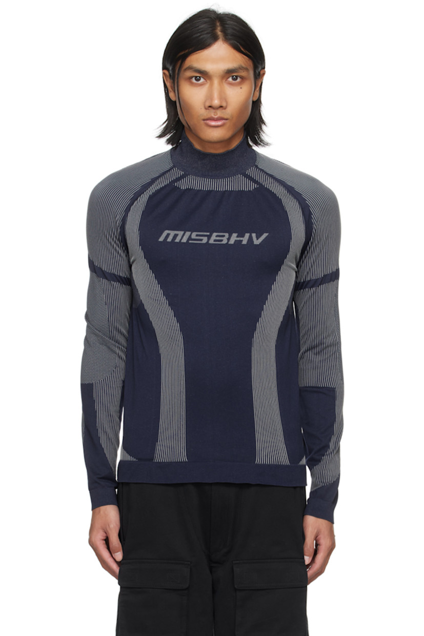 Breathable stretch recycled nylon-blend jersey turtleneck. Jacquard stripes and dots throughout.

· Rib knit stand collar, hem, and cuffs
· Jacquard logo at chest
· Raglan sleeves

Supplier color: Navy/White