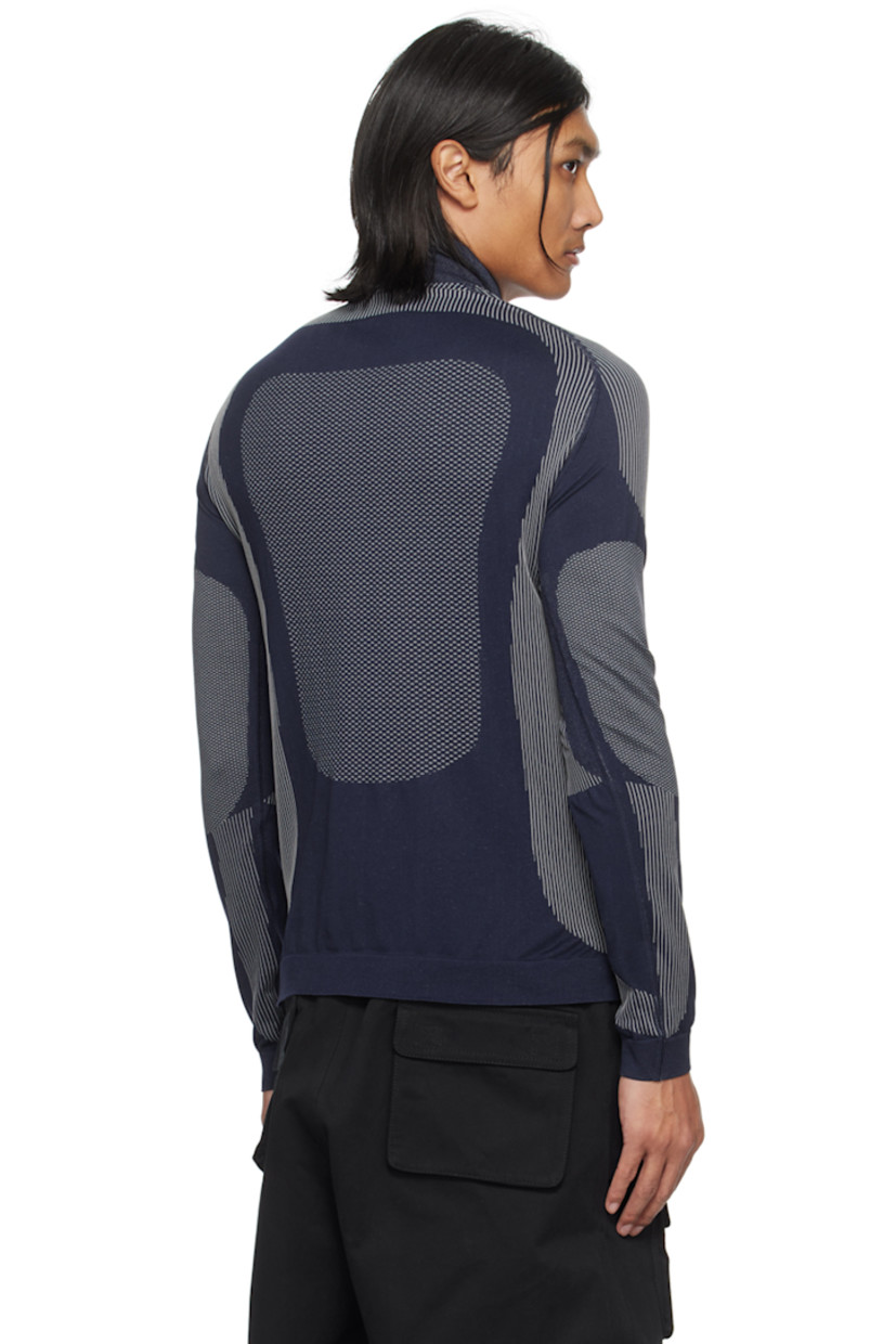 Breathable stretch recycled nylon-blend jersey turtleneck. Jacquard stripes and dots throughout.

· Rib knit stand collar, hem, and cuffs
· Jacquard logo at chest
· Raglan sleeves

Supplier color: Navy/White