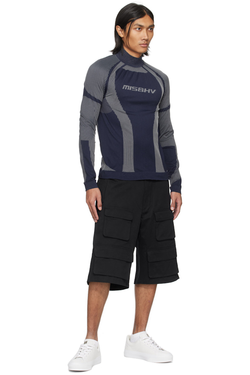 Breathable stretch recycled nylon-blend jersey turtleneck. Jacquard stripes and dots throughout.

· Rib knit stand collar, hem, and cuffs
· Jacquard logo at chest
· Raglan sleeves

Supplier color: Navy/White