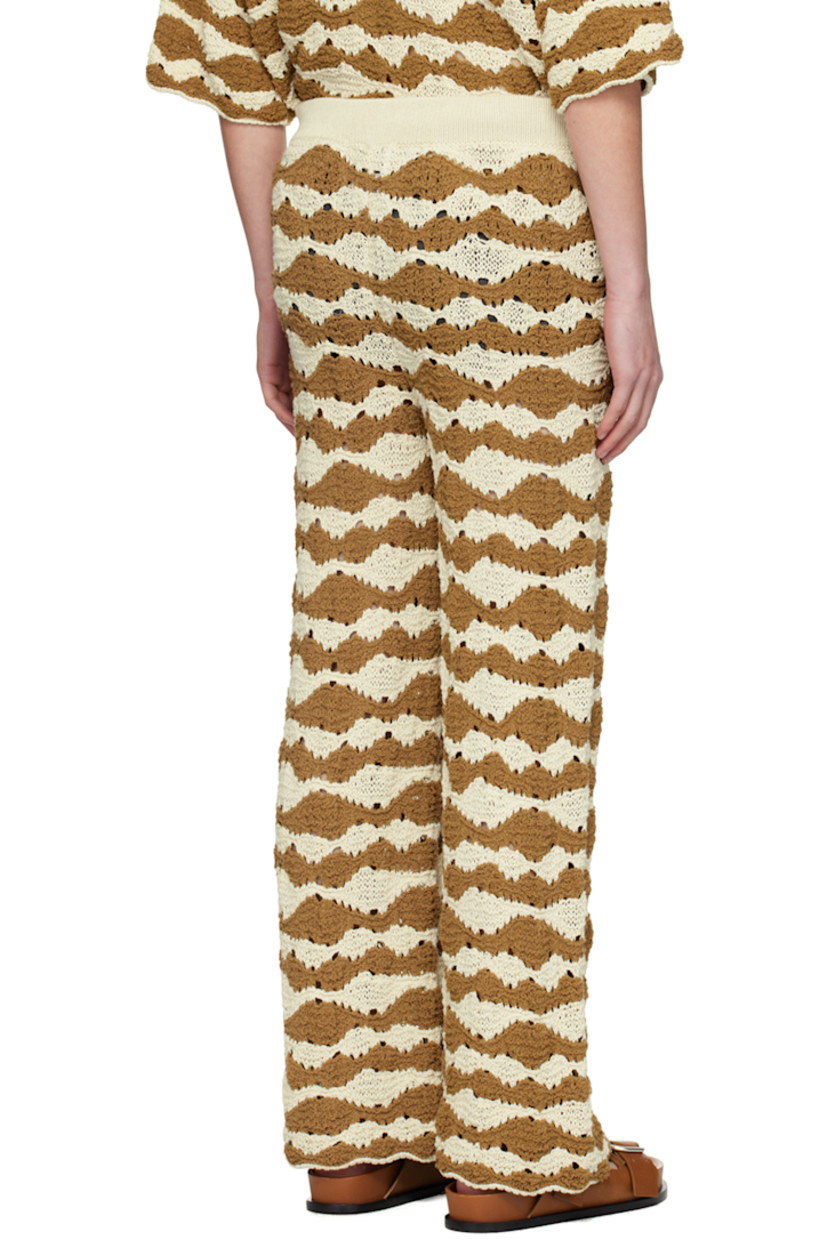Semi-sheer loose-fit open knit cotton-blend sweatpants. 

· Graphic stripes throughout
· Elasticized waistband 

Supplier color: Raffia/Brown