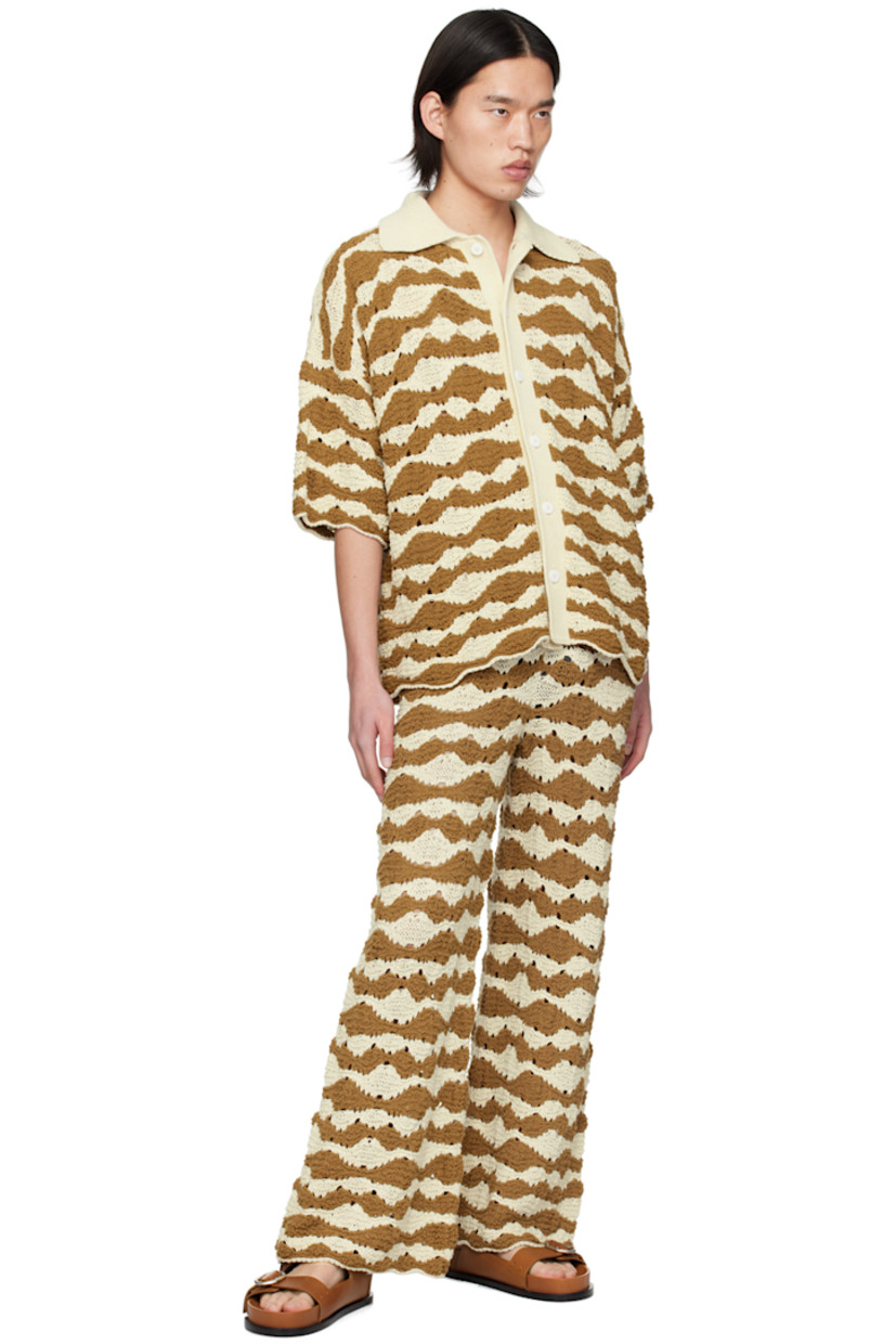 Semi-sheer loose-fit open knit cotton-blend sweatpants. 

· Graphic stripes throughout
· Elasticized waistband 

Supplier color: Raffia/Brown