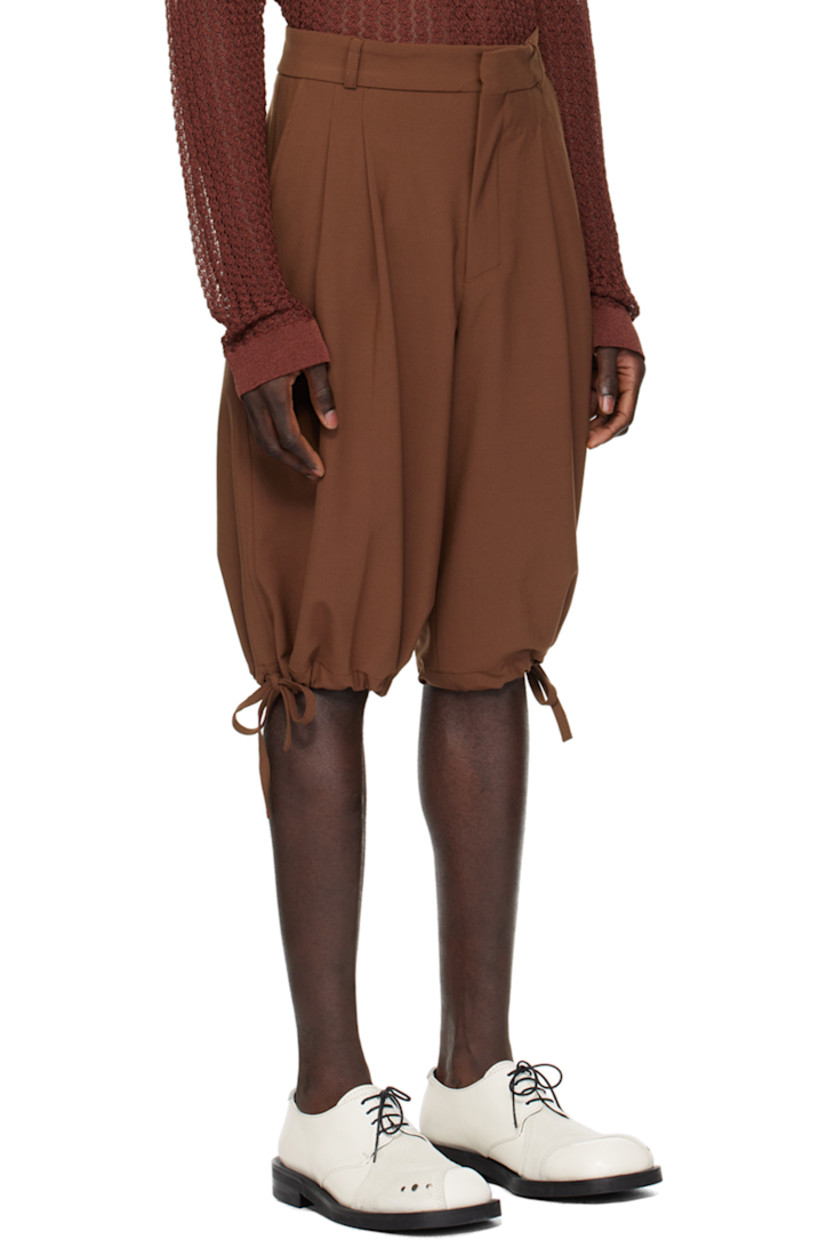 Stretch polyester- and virgin wool-blend broadcloth shorts.

· Belt loops
· Four-pocket styling
· Zip-fly
· Pleats at front
· Drawstring at cuffs

Supplier color: Glazed ginger