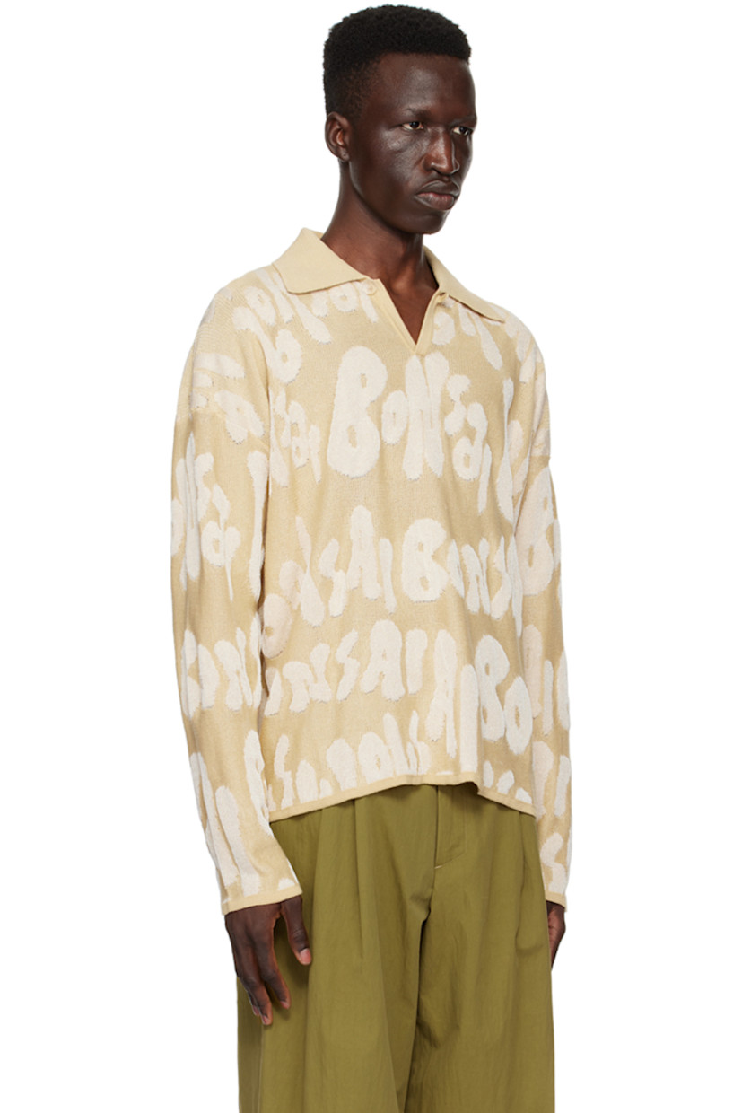 Knit cotton- and rayon-blend polo. Jacquard logo pattern throughout.

· Rib knit spread collar, hem, and cuffs
· Single-button placket
· Dropped shoulders

Supplier color: Almond oil