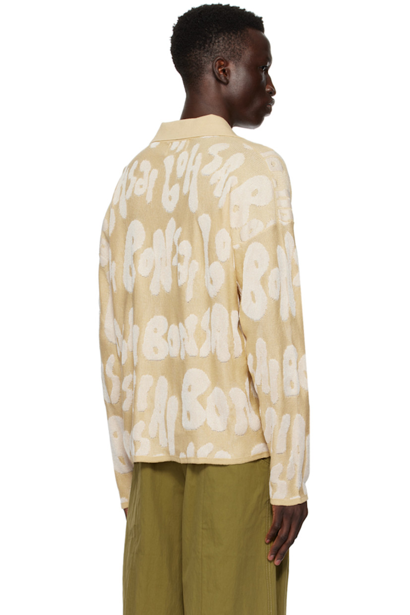Knit cotton- and rayon-blend polo. Jacquard logo pattern throughout.

· Rib knit spread collar, hem, and cuffs
· Single-button placket
· Dropped shoulders

Supplier color: Almond oil
