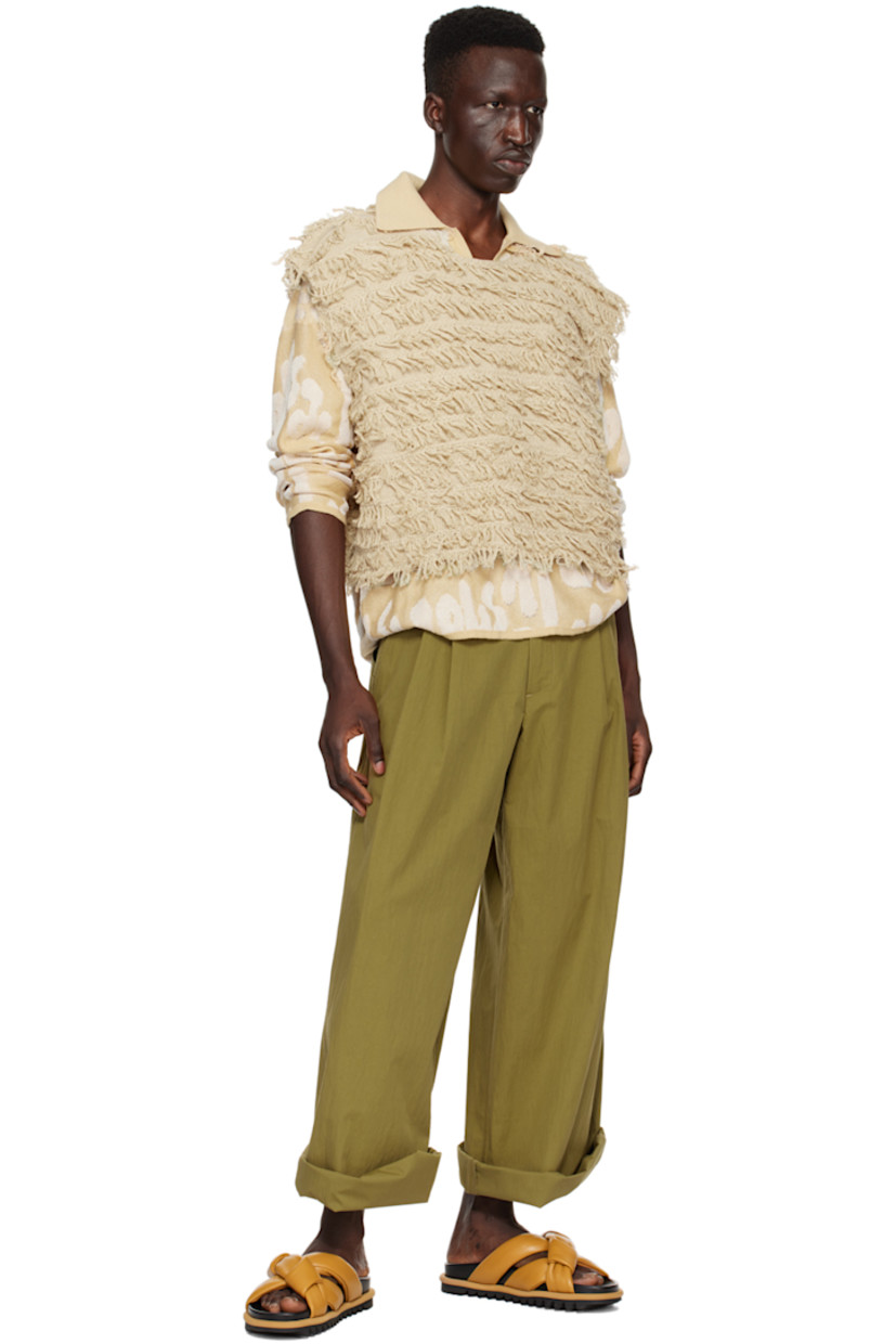 Knit cotton- and rayon-blend polo. Jacquard logo pattern throughout.

· Rib knit spread collar, hem, and cuffs
· Single-button placket
· Dropped shoulders

Supplier color: Almond oil