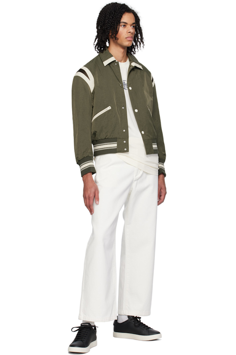 Non-stretch denim jeans. 

· Belt loops 
· Five-pocket styling 
· Zip-fly 
· Logo graphic bonded at front 

Supplier color: Bianco latte