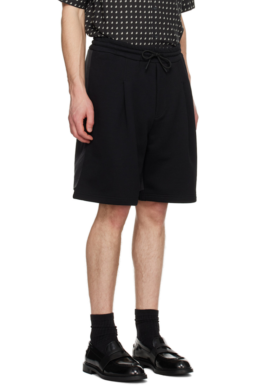 French terry and modal satin shorts.

· Layered construction 
· Drawstring at elasticized waistband 
· Two-pocket styling
· Zip-fly
· Pleats at front 
· Logo printed at back cuff   

Supplier color: Black
